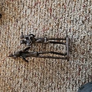 Dana B parents carrying small children bronze statue